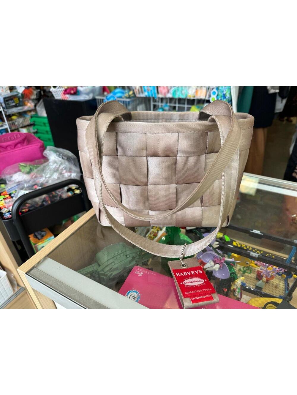 Harvey’s light brown tan seatbelt bag purse
